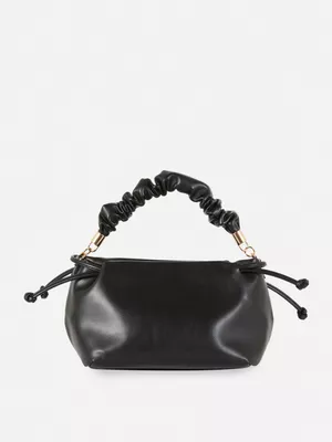 Bolso de mano fruncido de Paula Echevarría