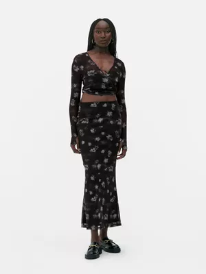 Falda midi de malla floral de Rita Ora