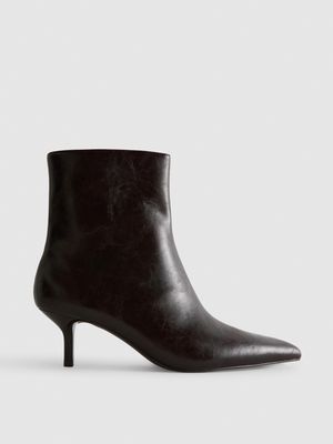 Botines de piel sintética de tacón tachuela