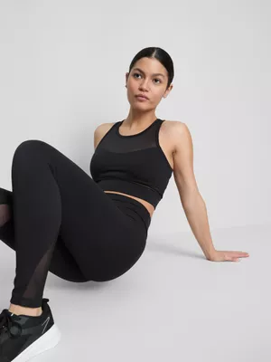 Camiseta corta de malla deportiva sin mangas