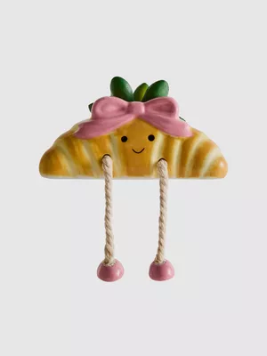 Adorno en forma de croissant para estantería