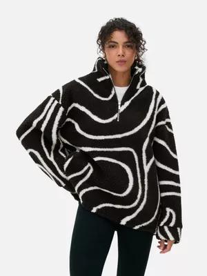 Forro polar de borreguito con media cremallera