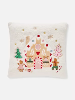Cojín cuadrado polar con casa de galleta de jengibre