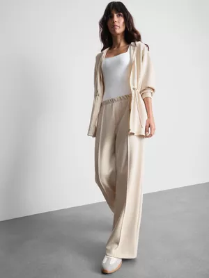 Pantalones anchos alforzados de Coleen Rooney