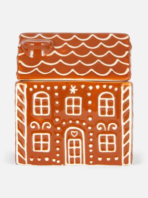 Vela aromática en tarro de cerámica en forma de casa