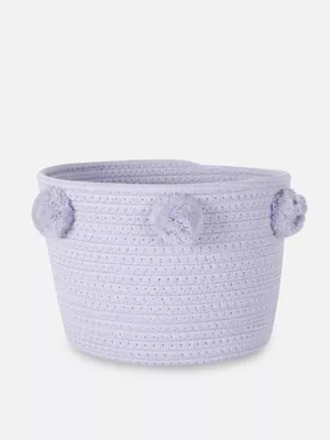 Cesta tejida con pompones