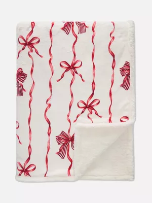 Manta con lazos y guirnaldas