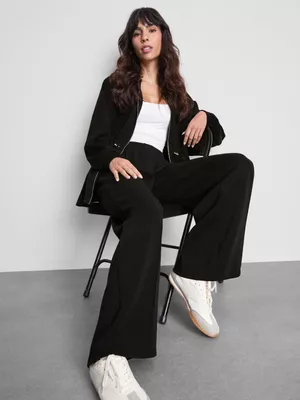 Pantalones anchos alforzados de Coleen Rooney